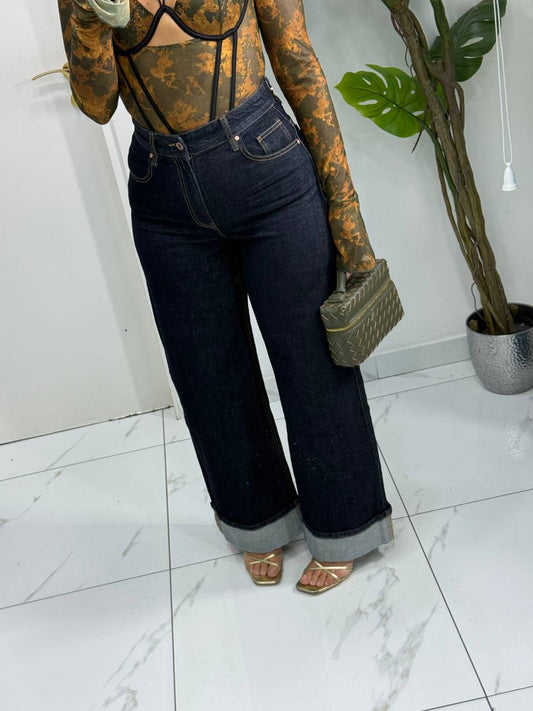 JEANS SCURO CON PIEGONE